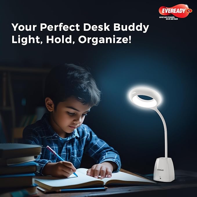 Child studying with a desk light on a dark background, featuring Eveready branding.