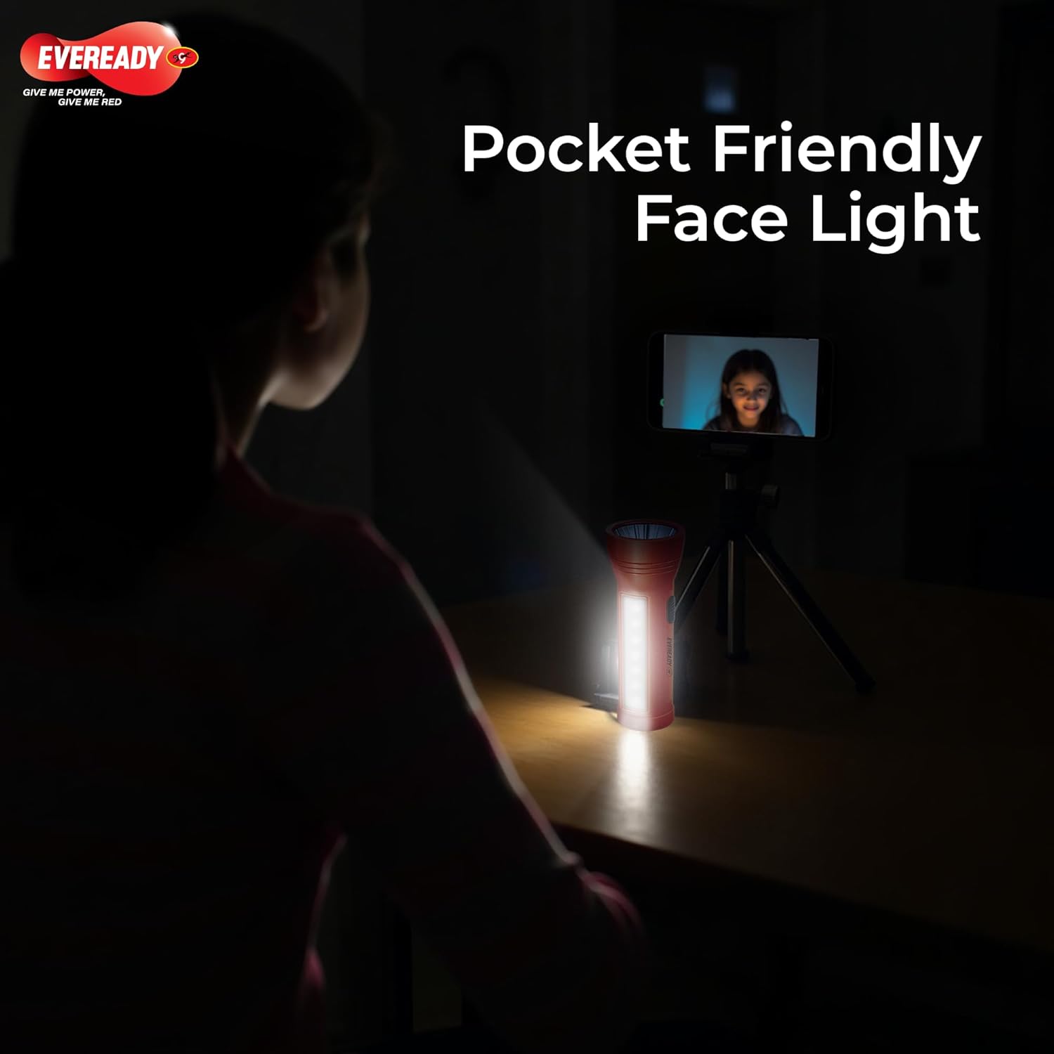 Person using a pocket-friendly Eveready Apollo DL20 in a dark room with Eveready branding.