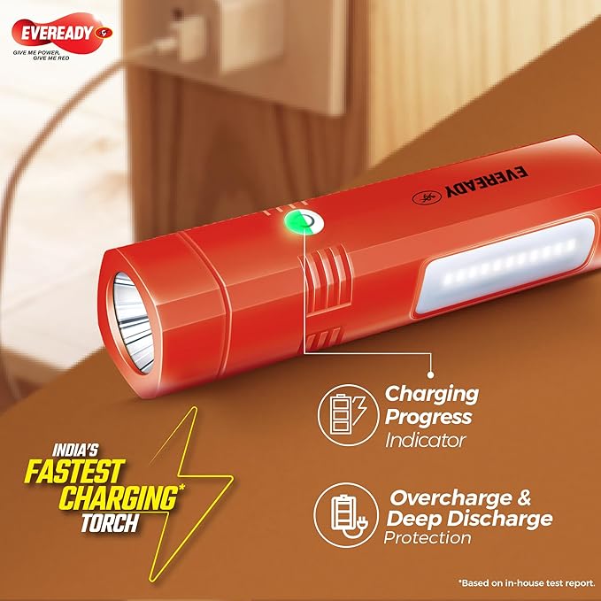 Red Eveready flashlight with charging progress indicator on a brown surface